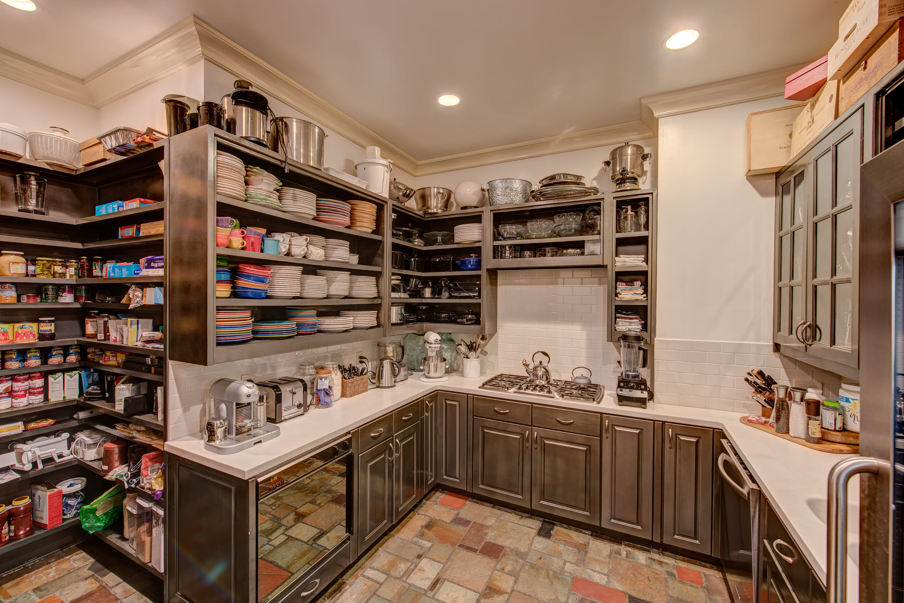 Kitchen with a large pantry and a large island.